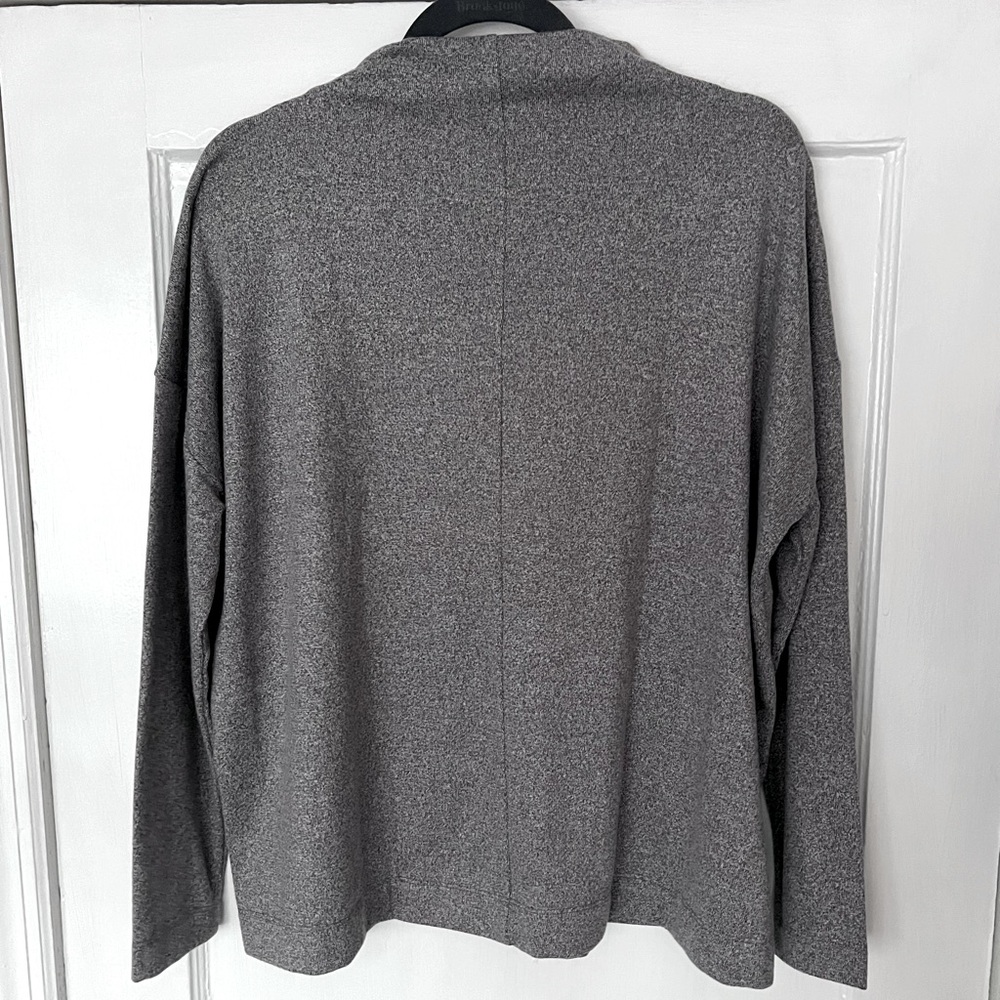 Tunic style mock neck sweater with an oversized feel